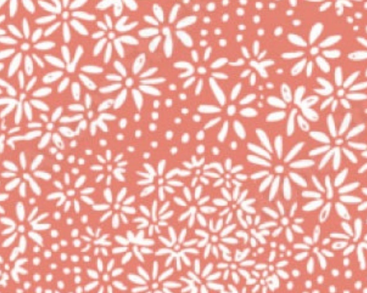 Image d’un motif floral blanc sur fond orange, idéal pour des accessoires de mode estivaux et vibrants.